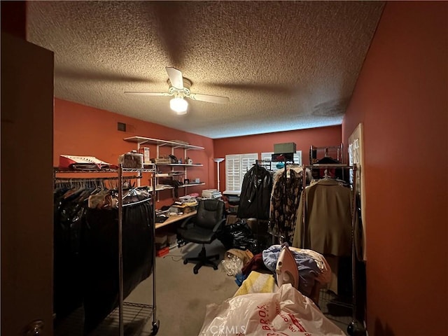 interior space featuring ceiling fan and a textured ceiling