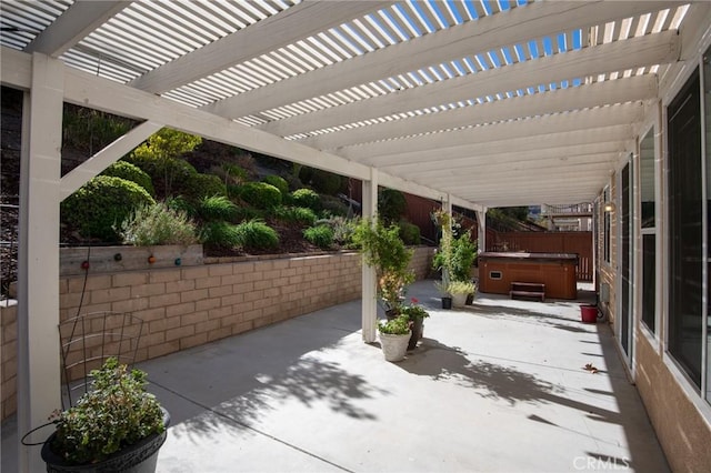 view of patio featuring a pergola and a hot tub