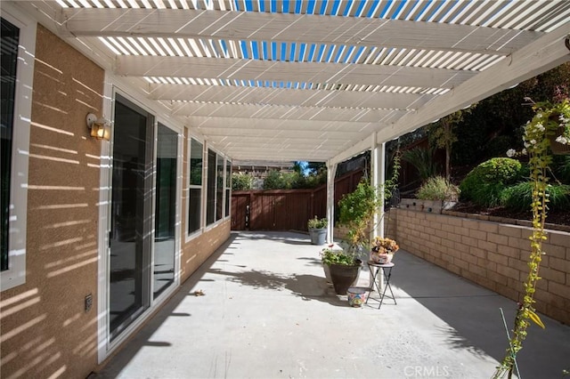 view of patio featuring a pergola