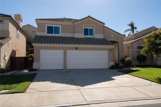 view of front facade with a front yard and a garage