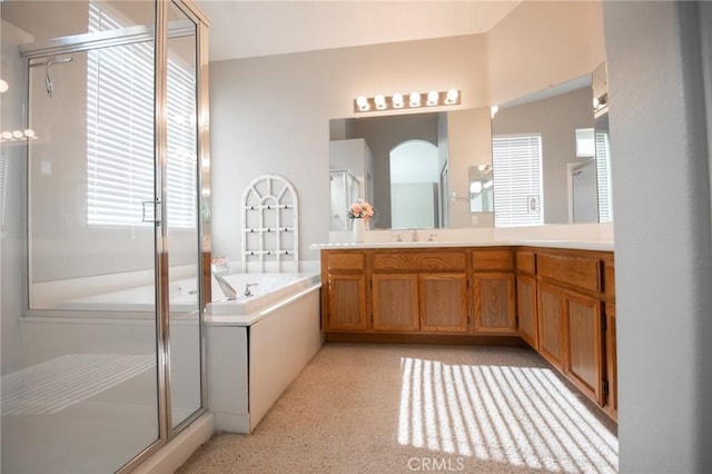 bathroom with separate shower and tub and vanity