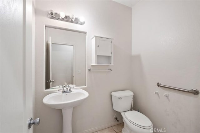 bathroom featuring tile patterned floors and toilet