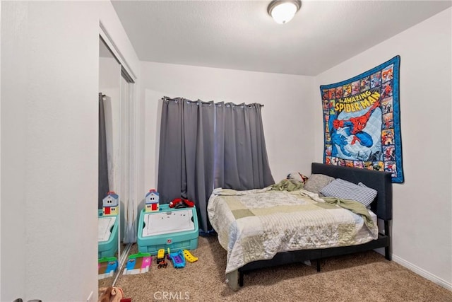 carpeted bedroom featuring a closet