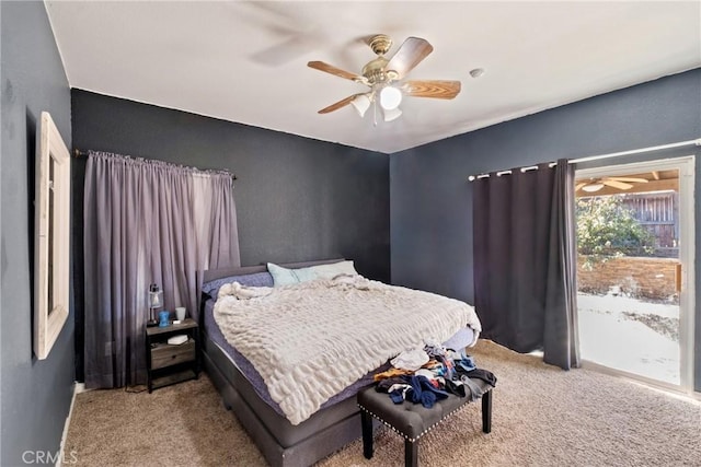 carpeted bedroom featuring ceiling fan and access to exterior