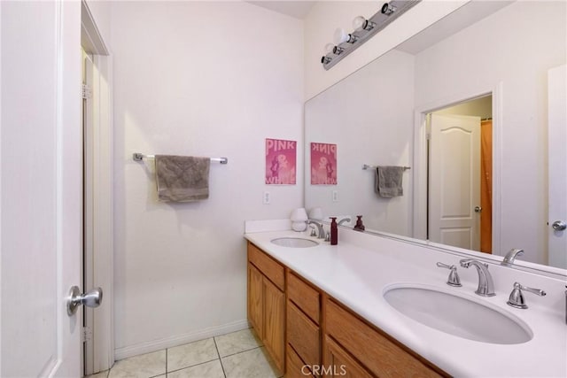 bathroom featuring tile patterned flooring and vanity