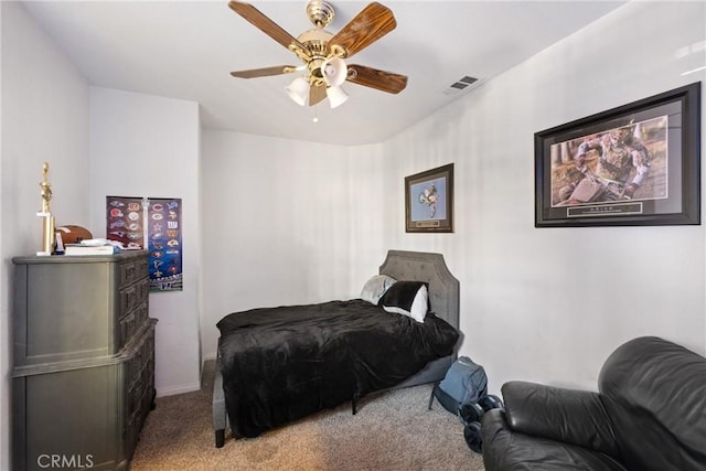 bedroom with ceiling fan and light carpet