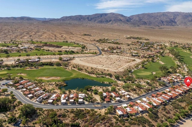 drone / aerial view with a water and mountain view