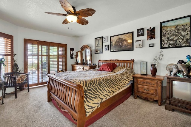 bedroom with light carpet, multiple windows, and ceiling fan