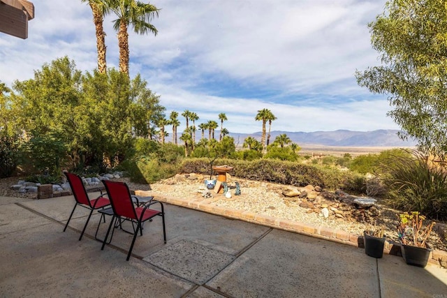 view of patio / terrace featuring a mountain view