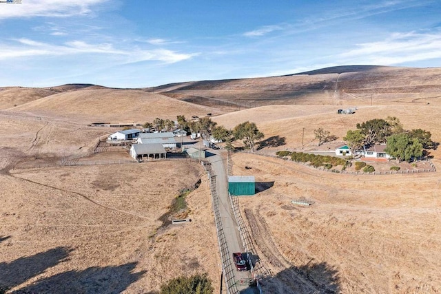 drone / aerial view with a mountain view and a rural view