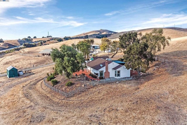 birds eye view of property with a mountain view