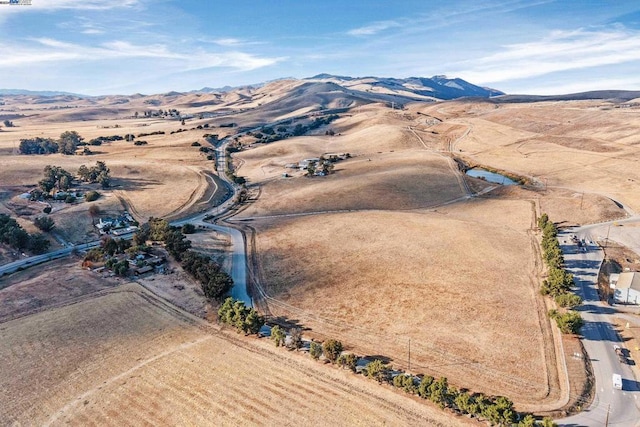 aerial view with a mountain view and a rural view