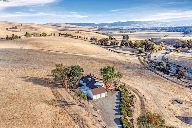 bird's eye view featuring a mountain view and a rural view