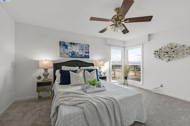 bedroom with ceiling fan and carpet floors