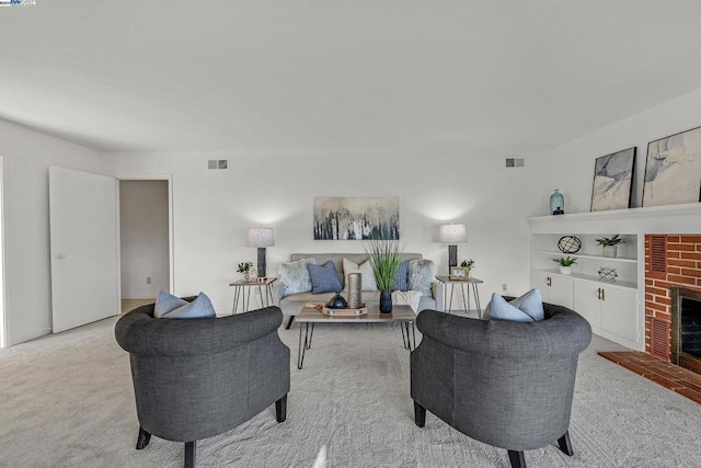 carpeted living room featuring a fireplace