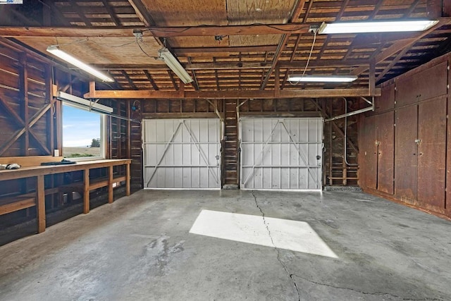 garage featuring wood walls