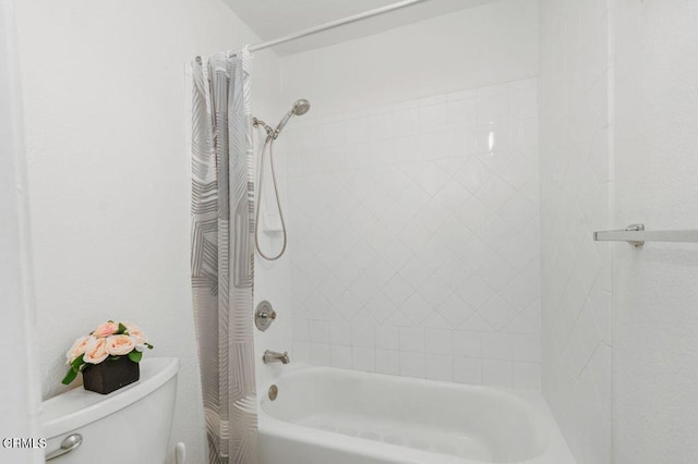 bathroom with shower / tub combo and toilet