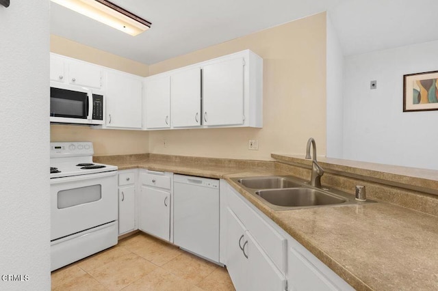 kitchen featuring white cabinets, light tile patterned flooring, white appliances, and sink