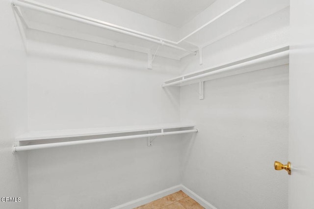 walk in closet featuring light tile patterned floors