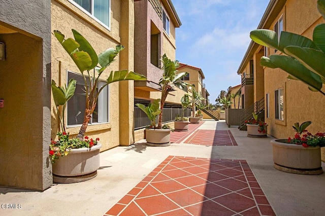 view of property's community with a patio area