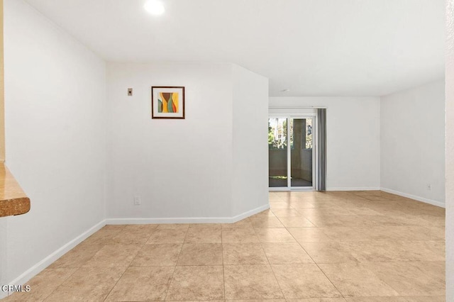 spare room with light tile patterned floors