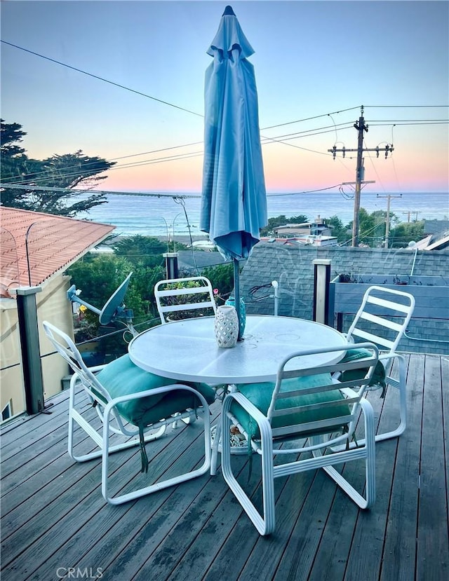 deck at dusk with a water view