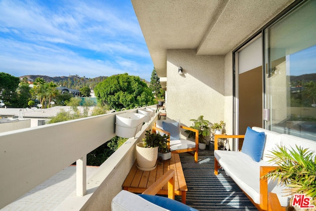 balcony featuring a mountain view