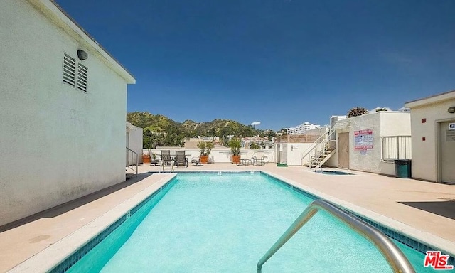 view of swimming pool with a patio