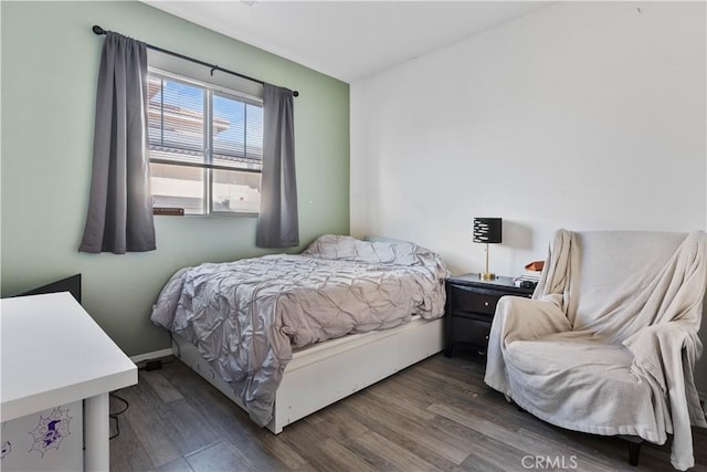 bedroom featuring dark hardwood / wood-style floors