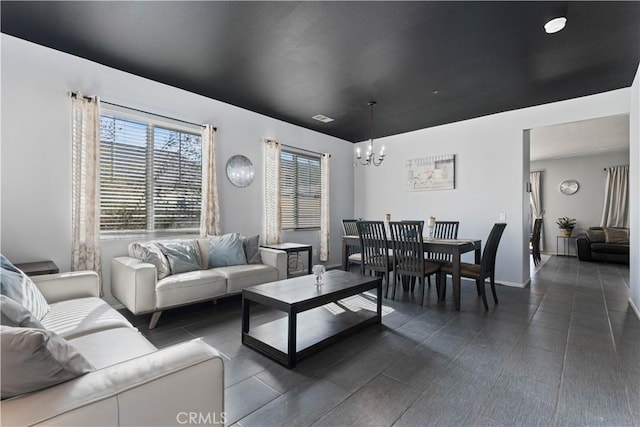 living room featuring a notable chandelier