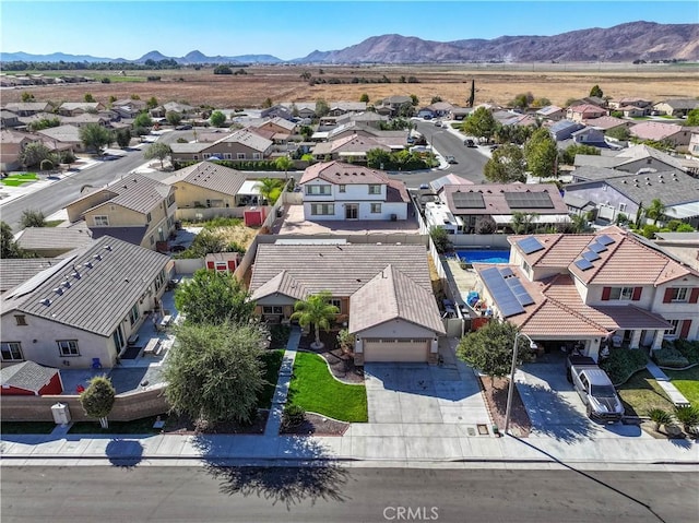 birds eye view of property featuring a mountain view