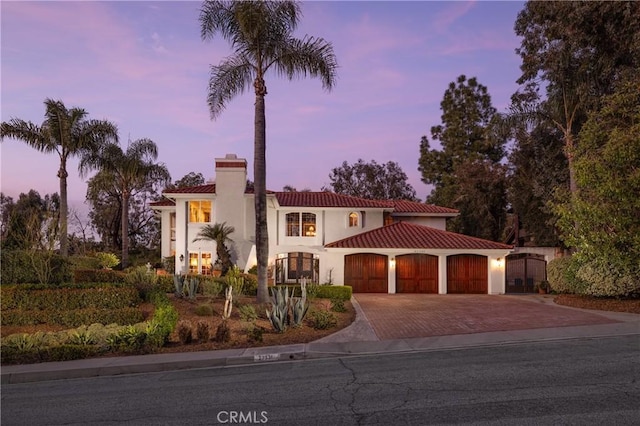 mediterranean / spanish-style house featuring a garage