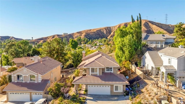 birds eye view of property with a mountain view