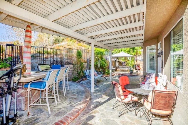 view of patio / terrace featuring an outdoor bar