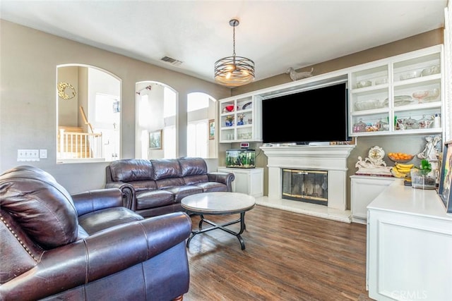 living room with dark hardwood / wood-style flooring