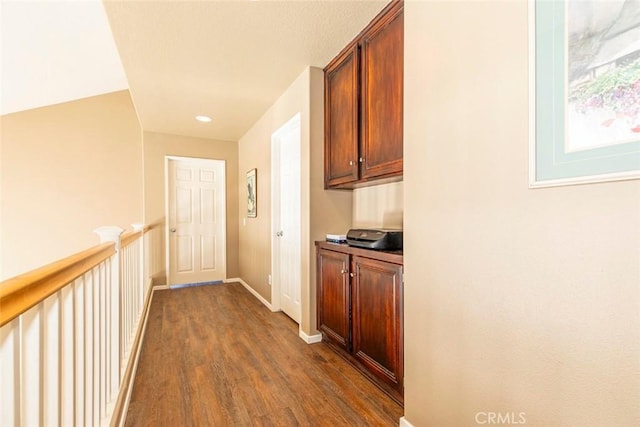 hall with dark wood-type flooring