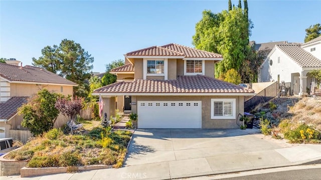 mediterranean / spanish-style house featuring a garage