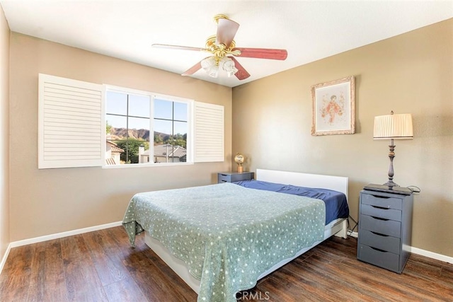 bedroom featuring ceiling fan and dark hardwood / wood-style flooring