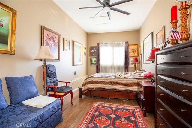 bedroom featuring ceiling fan and wood-type flooring