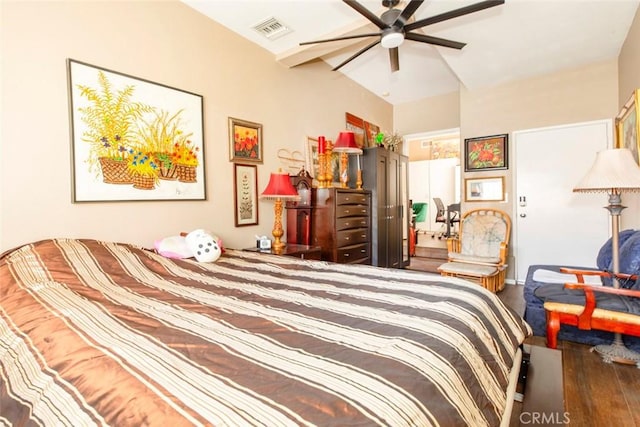 bedroom featuring ceiling fan, dark hardwood / wood-style flooring, and lofted ceiling