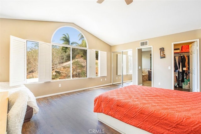 bedroom featuring ceiling fan, dark hardwood / wood-style floors, and lofted ceiling