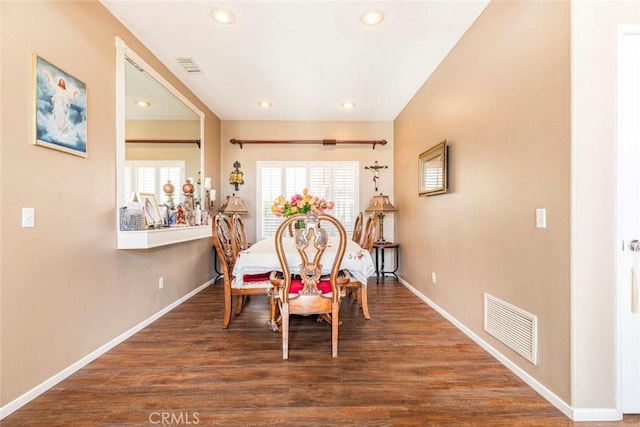 dining area with dark hardwood / wood-style flooring