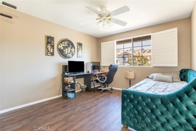 office space with ceiling fan and dark hardwood / wood-style flooring