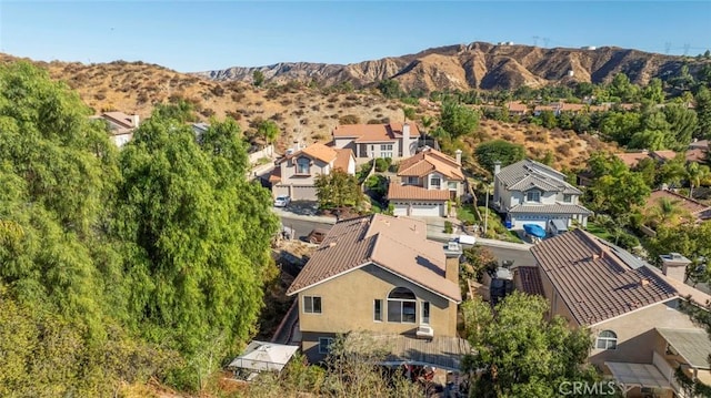 birds eye view of property with a mountain view