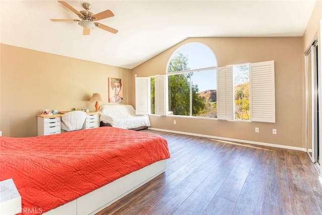 bedroom with vaulted ceiling, ceiling fan, and dark wood-type flooring