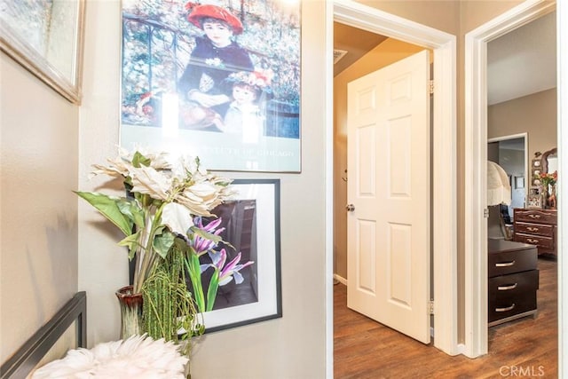 hallway with dark wood-type flooring