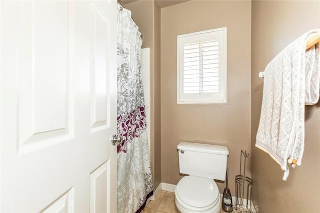 bathroom featuring toilet and tile patterned floors