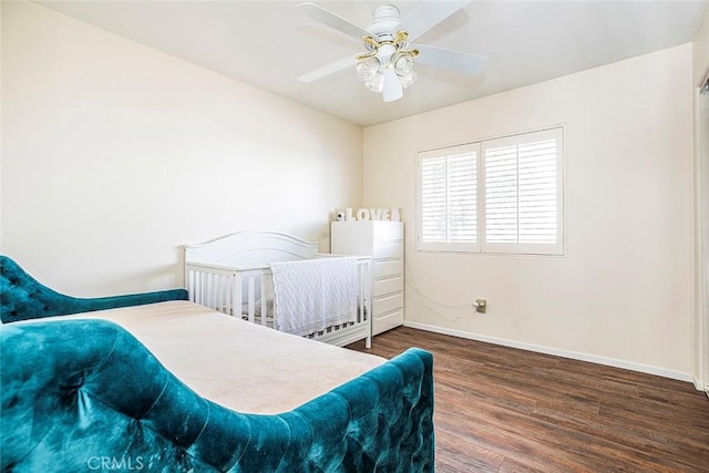 bedroom with ceiling fan and dark hardwood / wood-style flooring