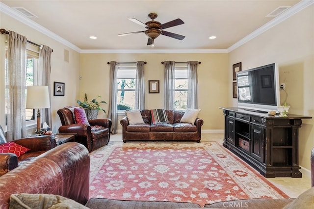 living room with crown molding, light hardwood / wood-style flooring, a wealth of natural light, and ceiling fan