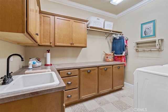 laundry room featuring cabinets, sink, washer / dryer, and ornamental molding